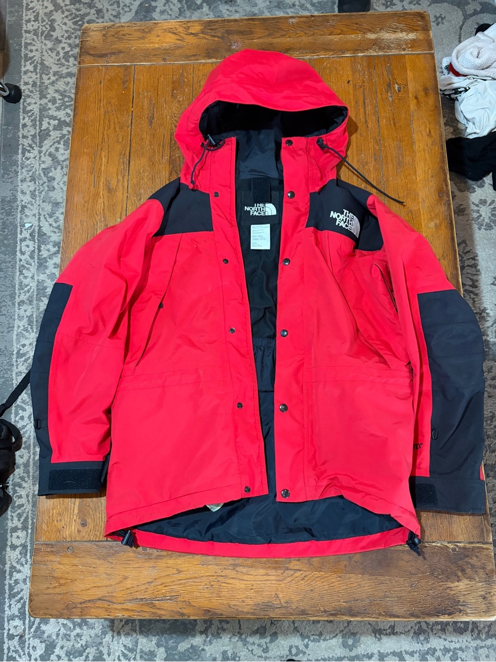 The North Face Red and Black Hooded Raincoat